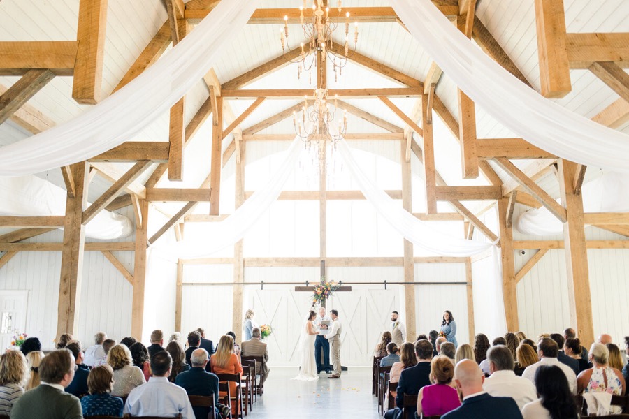 Wedding ceremony inside the Heyward Manor barn